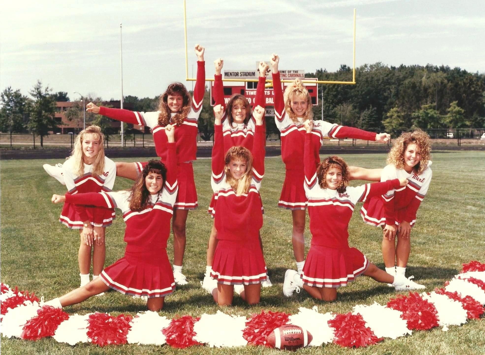 Stephanie cheering on the sidelines
